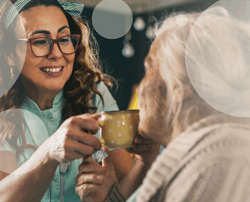 nurse giving patient drink