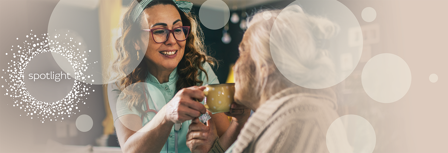 nurse giving patient drink