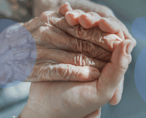 young hand holding old hand
