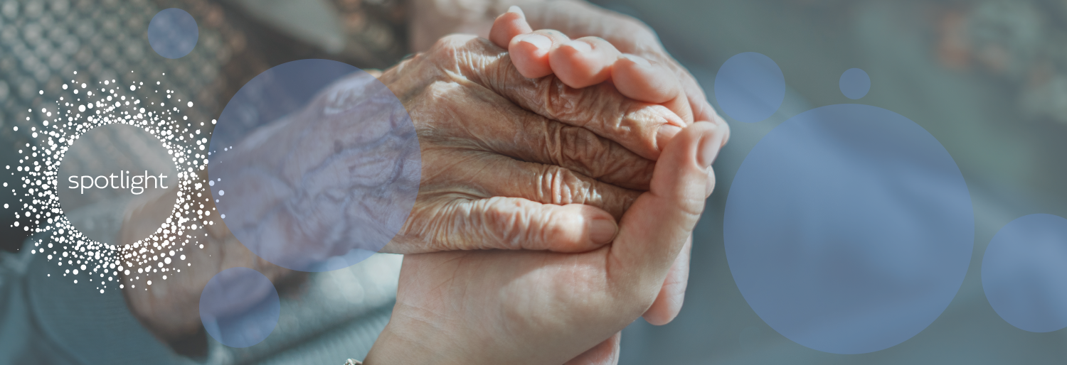young hand holding old hand