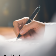 person writing a letter