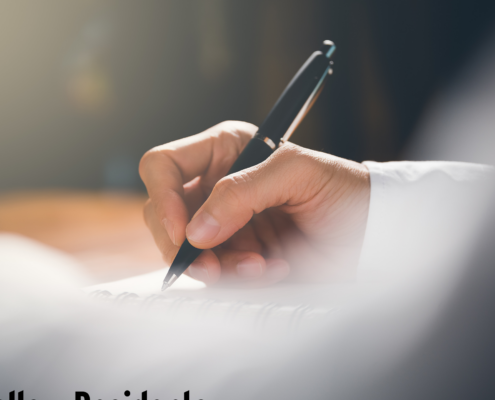 person writing a letter