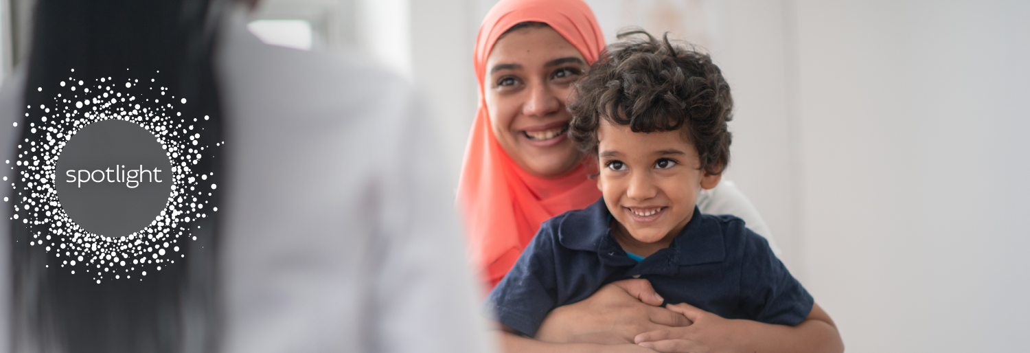 woman of colour in headscarf with her son
