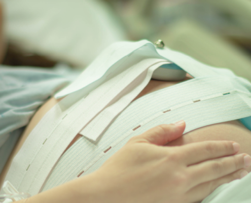 pregnant woman on hospital bed