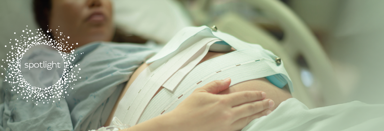 pregnant woman on hospital bed